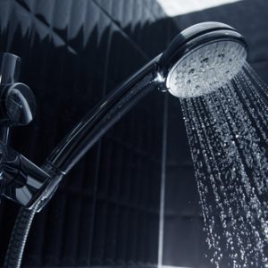 A shower head runs water